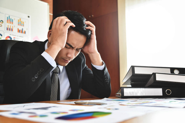 Businessman having headache. - Фото, изображение