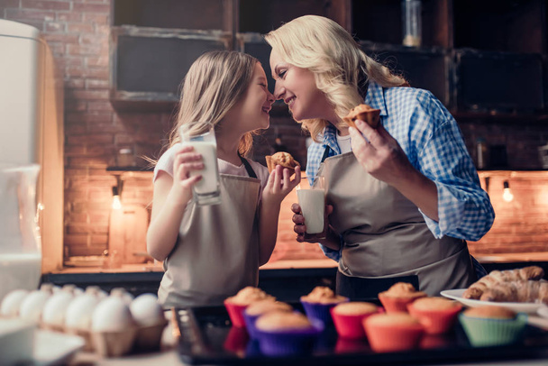 Grandmother and granddaughter cooking on kitchen - Foto, imagen