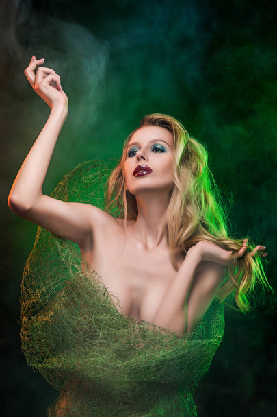 Topless girl blonde wrapped in a green network for bouquets, cov - Fotografie, Obrázek