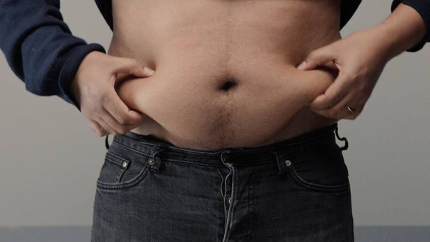 sobrepeso homem closeup de barriga
 - Foto, Imagem