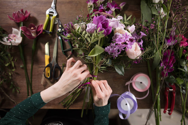 attenuate hands which making bouquet for Mothers day - Photo, Image