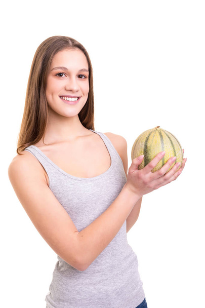 Young woman holding a fresh watermelon, isolated over white background - Photo, Image