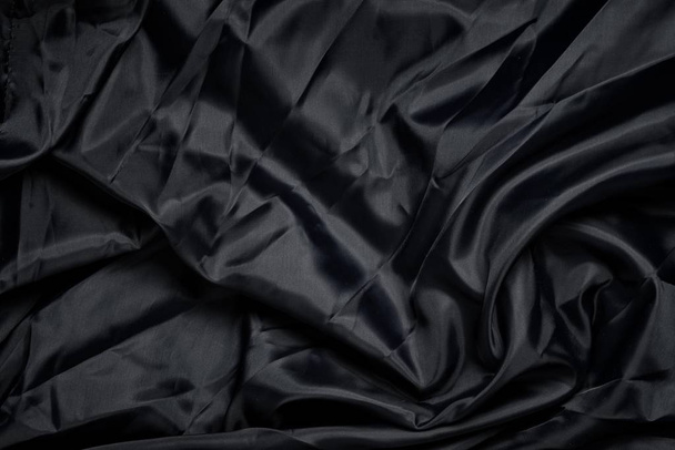 Гладкая элегантная ткань из глубокого черного шелка или сатина. Ретро стиль
. - Фото, изображение