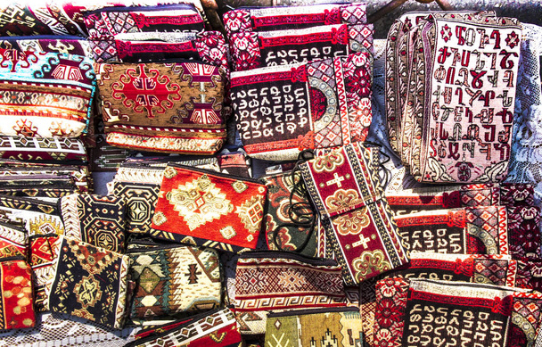 colorful fabrics and other folk products at a roadside stall wit - Photo, Image