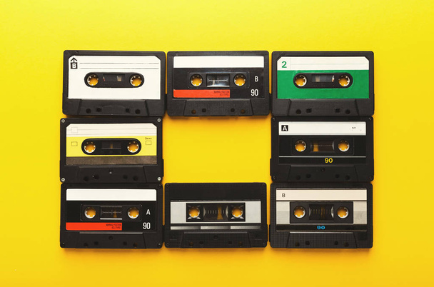 Vintage audio cassettes on yellow background - Photo, Image