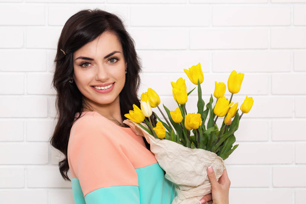beautiful woman with a bouquet - Photo, Image