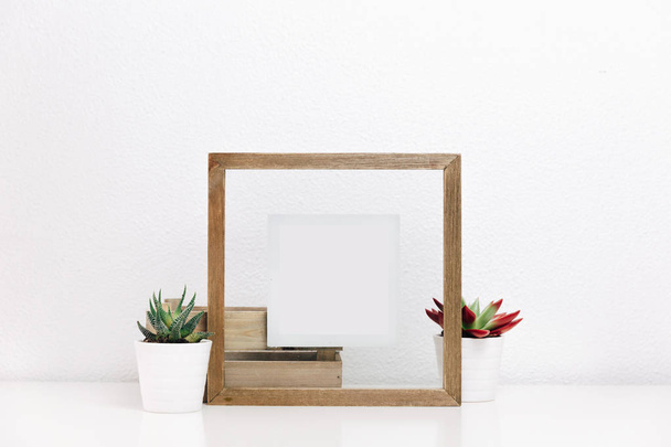 Wooden frame mock up with succulents pots. Nordic Scandinavian style home interior  - Фото, изображение