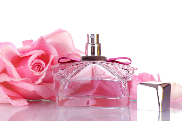 Perfume bottle and pink rose isolated on white - Фото, зображення