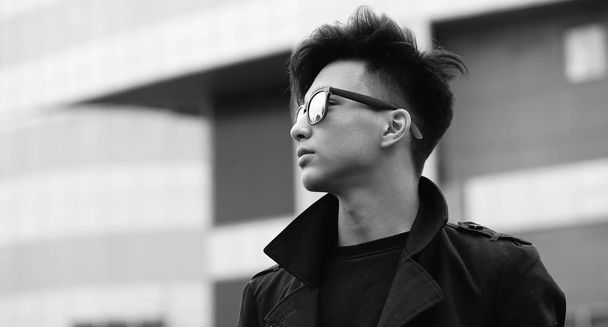 Black White photo of Asian young man outdoors posing - Photo, Image