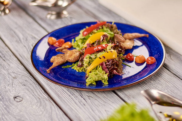 Warm salad with quail and nut sauce. - Zdjęcie, obraz
