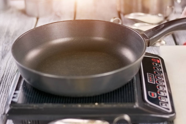 Empty skillet on electric stove. - Photo, Image