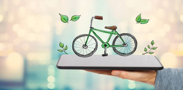 Eco Bicycle with man holding a tablet - Zdjęcie, obraz