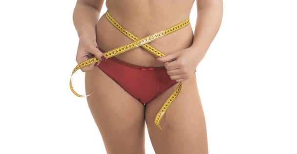 donna sovrappeso con nastro isolante su sfondo bianco
 - Foto, immagini