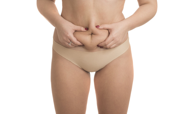 mujer obesa aprieta su grasa en el estómago
 - Foto, Imagen