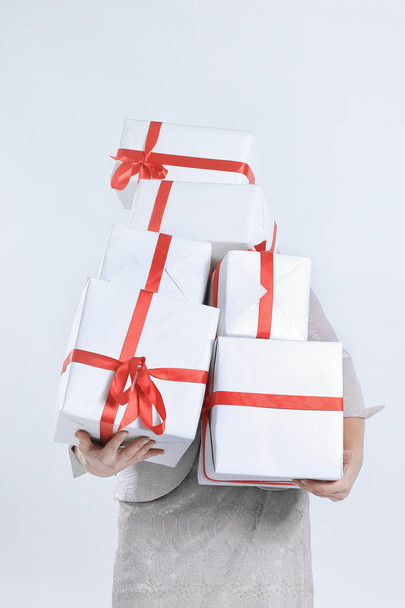 closeup of woman with lots of gift boxes. - Foto, imagen