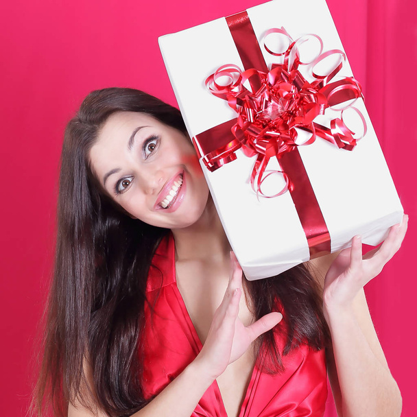 closeup. happy beautiful woman showing her gift. - Foto, Imagem