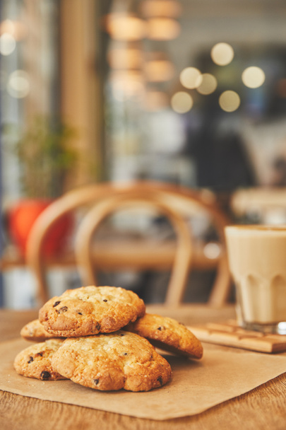Chocolate chip cookies in cafe on table with coffee - Fotó, kép