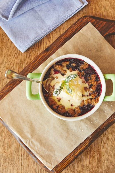 Berry crumble served in pot on table - Photo, Image