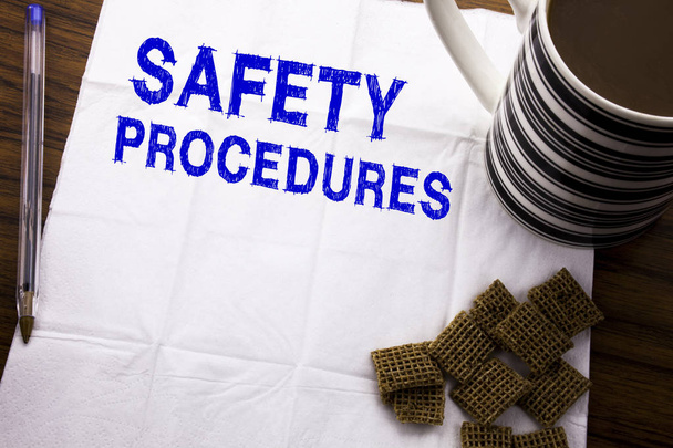 Hand writing text caption showing Safety Procedures. Business concept for Accident Risk Policy written on tissue paper on the wooden background with pen and healthy coffee in the restaurant - Photo, Image