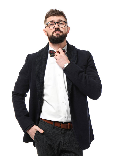 Portrait of handsome hipster in stylish outfit on white background - Photo, image