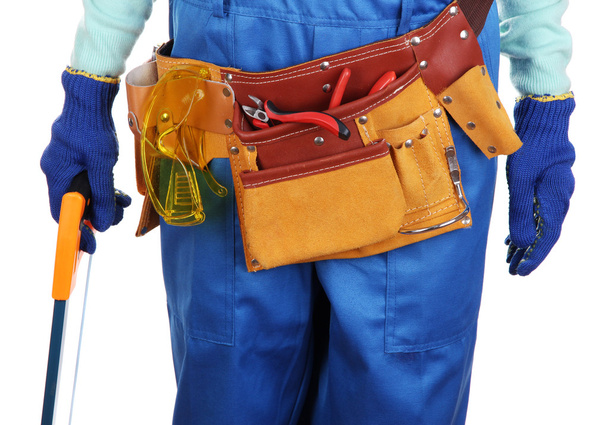 Male builder in blue overalls with saw isolated on white - Φωτογραφία, εικόνα
