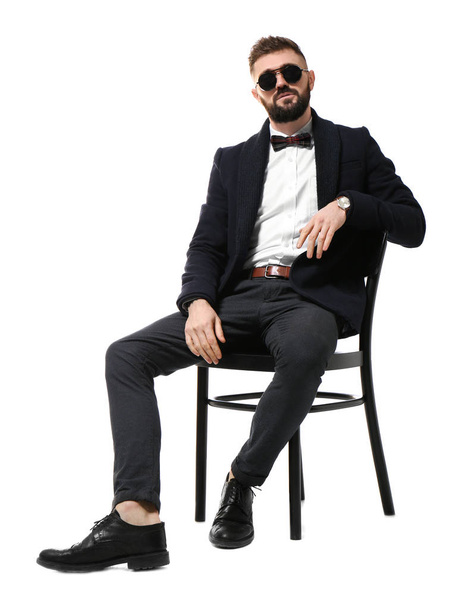 Portrait of handsome hipster in stylish outfit on white background - Фото, изображение