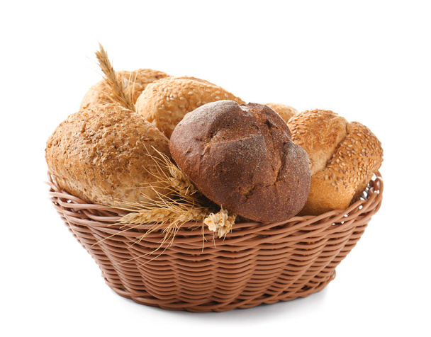 Basket with bread products on white background - Φωτογραφία, εικόνα