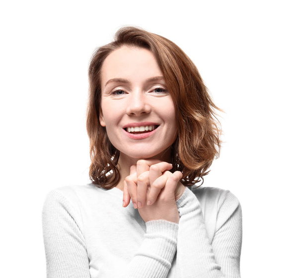 Portrait of smiling woman on white background - Zdjęcie, obraz