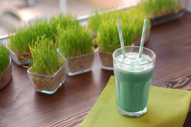 Glass with protein shake on window sill in sport bar - Foto, immagini