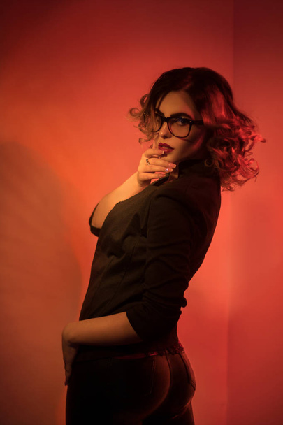 Sexy young secretary in glasses and red lips - 写真・画像