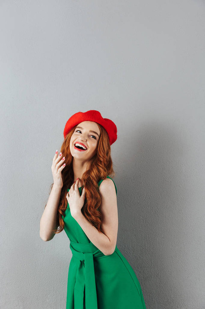 Redhead young cheerful lady looking aside. - Photo, image