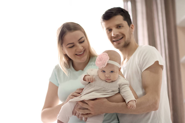 Young parents with baby at home - Photo, image