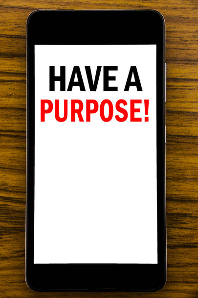 Handwriting Announcement text showing Have A Purpose. Business concept for Dreams Choose Vision Written on mobile phone cellphone with wooden background with space on the table - Photo, Image