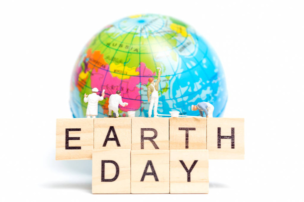 Miniature people : Painters painting on The globe on white background , Earth day concept - Photo, Image
