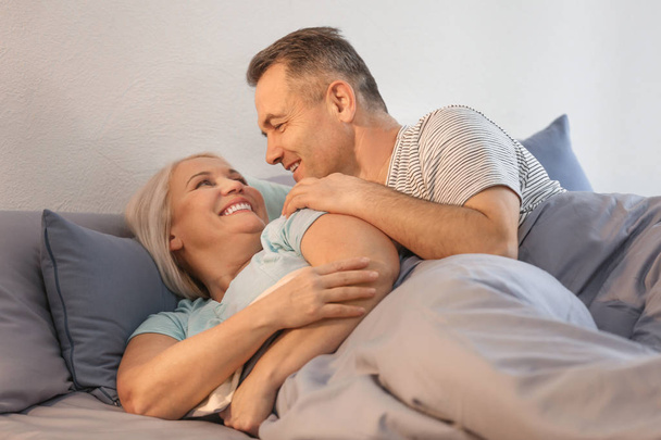 Senior couple in bed together - 写真・画像