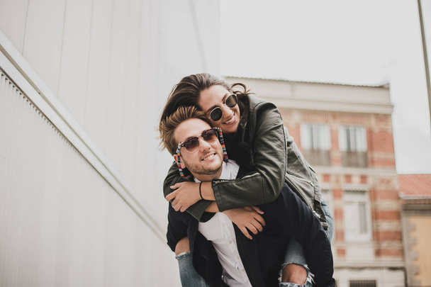 beautiful young couple in love posing outdoors  - Fotó, kép