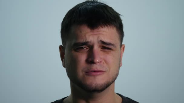 Upset Sad Young Man on White Background - Filmati, video