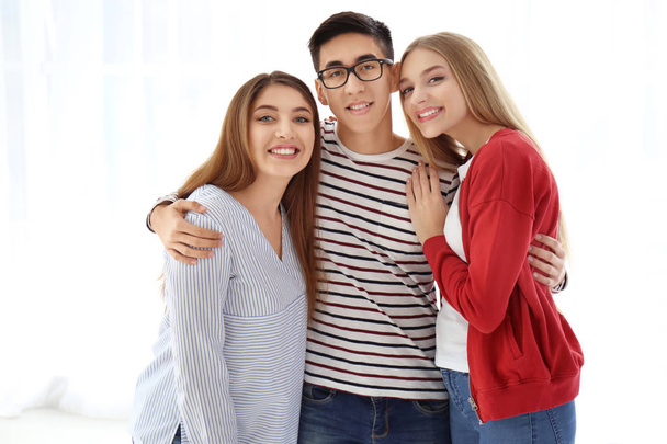Young smiling people on white background - Φωτογραφία, εικόνα