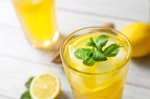 Glass of fresh lemonade on table - Photo, image