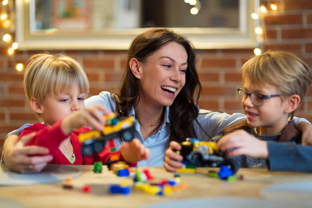 Mother and Children Playing with Blocks At Home - Foto, Imagen
