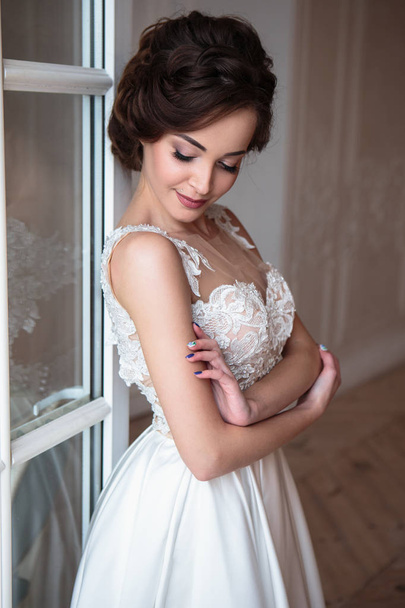 Beautiful bride in luxury dress. Beautiful young woman in wedding photosession - 写真・画像