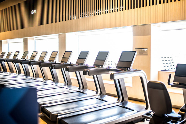 treadmills in a gym with beautiful light from the window gym machines  - Photo, Image
