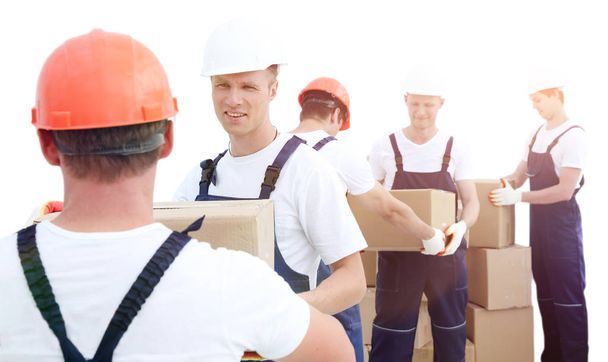 Group of people builders with boxes - Foto, Bild