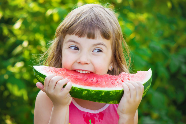 A child eats watermelon. Selective focus. - Fotoğraf, Görsel