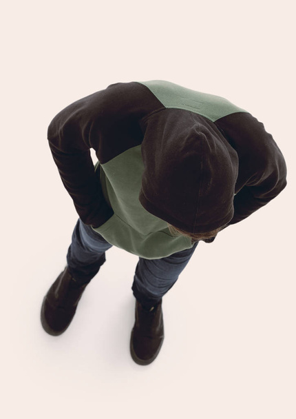 view from above. Hipster in a jacket with a hood looking down - Fotoğraf, Görsel