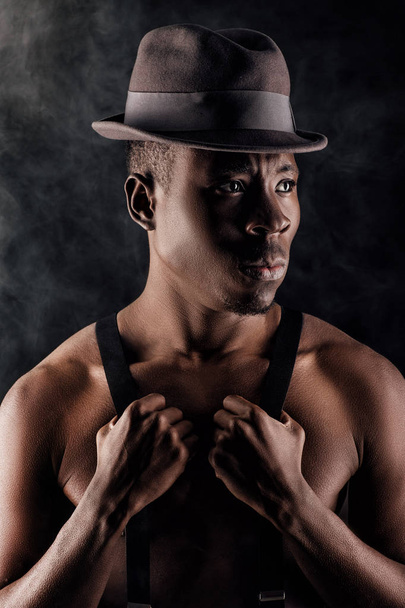 afro-american man in hat and suspenders - Фото, изображение