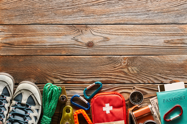 Travel items for hiking tourism still life over wooden background - Photo, Image