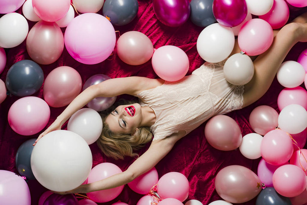 Pin up woman in balloons, round pot blush. - 写真・画像