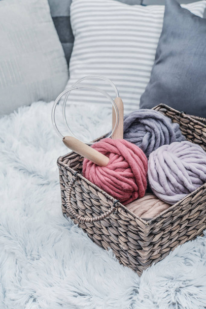 Balls of  super chunky merino woolen yarn with needles - Fotó, kép