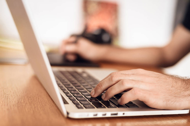 Close up freelancer bearded man drawing at laptop sitting at desk. - Fotografie, Obrázek